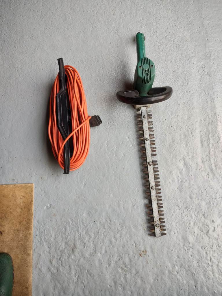 Black & Decker electric hedge trimmer & cable.