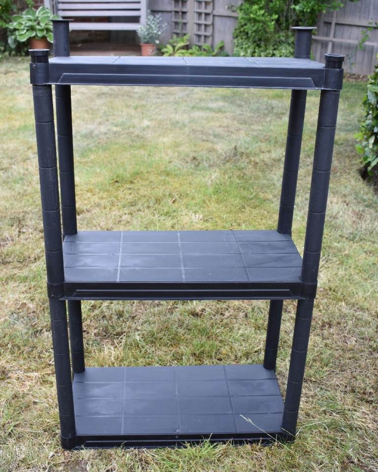 Sturdy Black Plastic Shelving Unit with Three Tiers