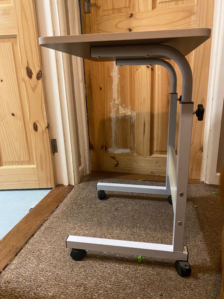 Over the bed adjustable height table 