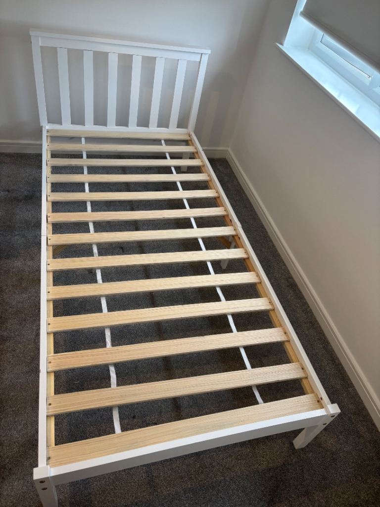 White wooden single bed