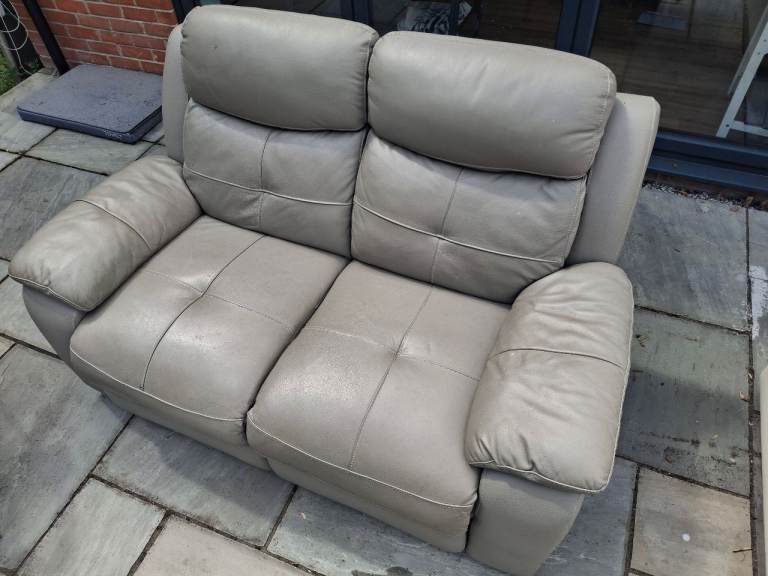 Leather two seat reclining sofa