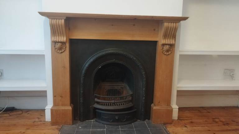 Iron and pine Victorian fireplace surround