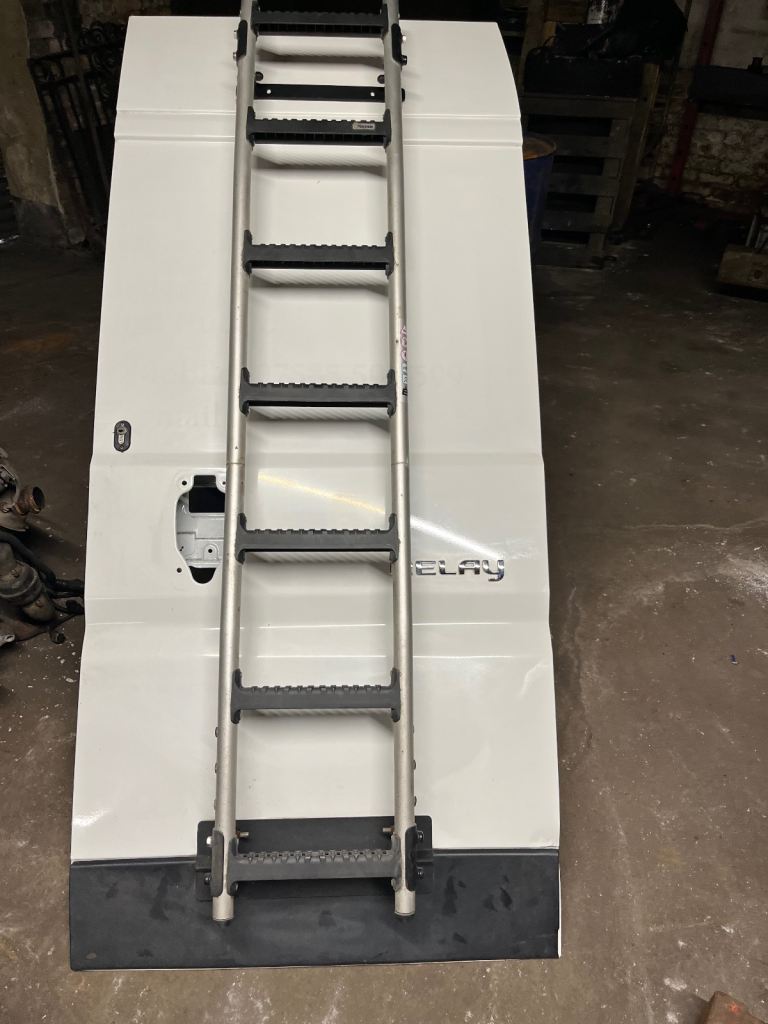 Rear drivers side ( off side ) door in white.