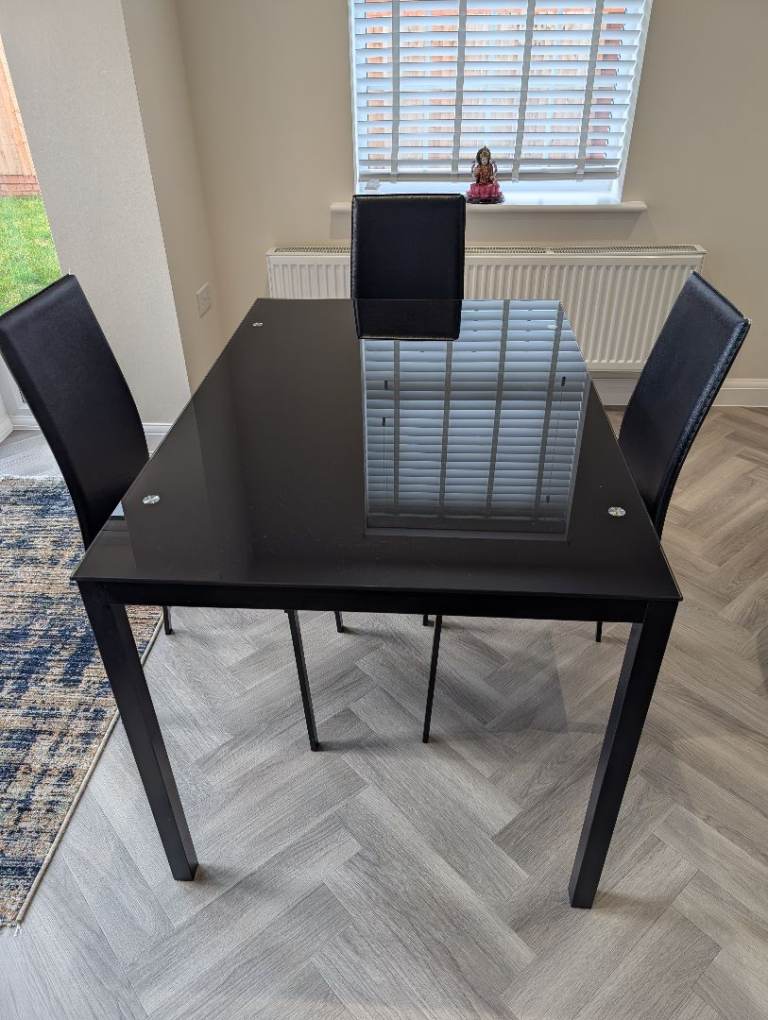 Black dining table and chairs set 