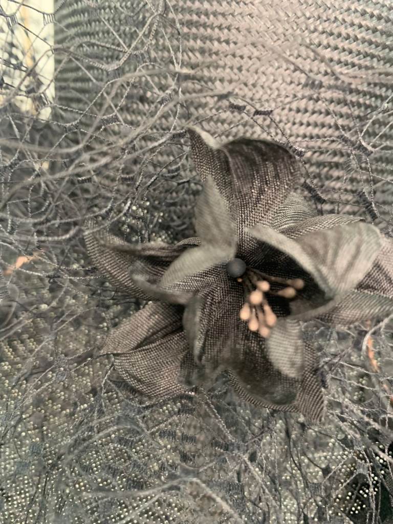 Graham Smith floral fascinator with a wide brim.