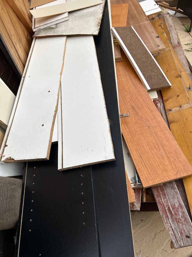 Collection of various wood and chipboard sheets for DIY projects