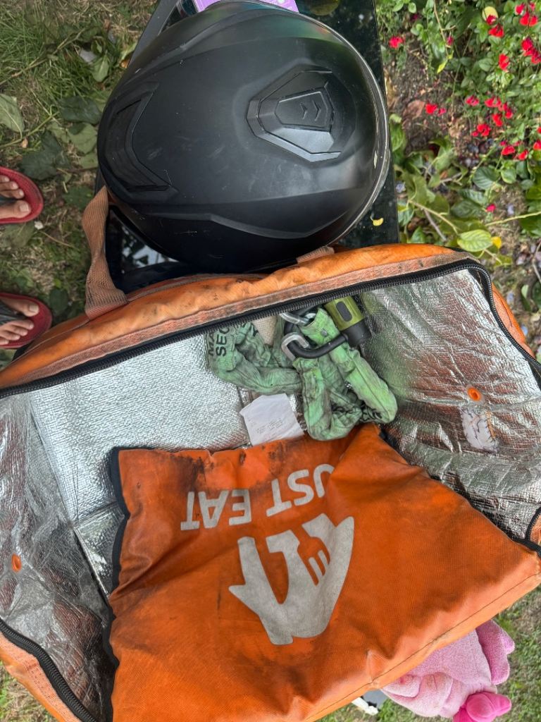 Helmet, bike chain lock, just eat delivery bag 