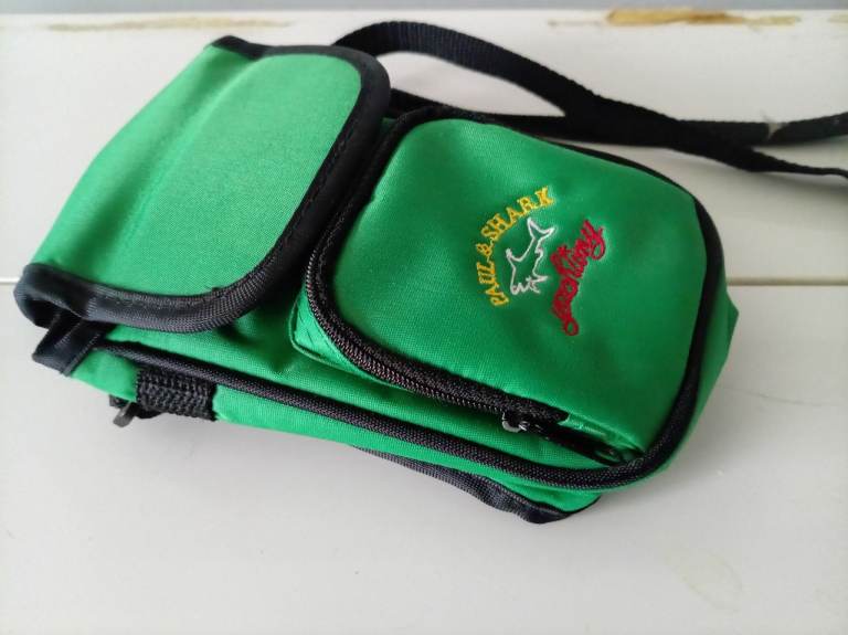 Paul and shark camera crossbody bag in green. 