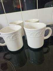 23 white mugs good condition  phone only