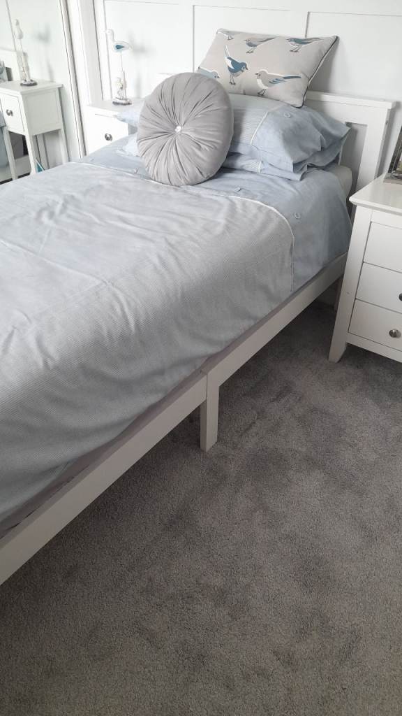 White wooden single bedframe
