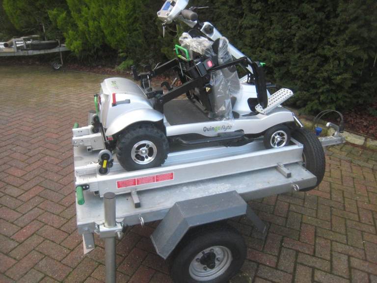 Quingo Flyte scooter with ramped trailer.
