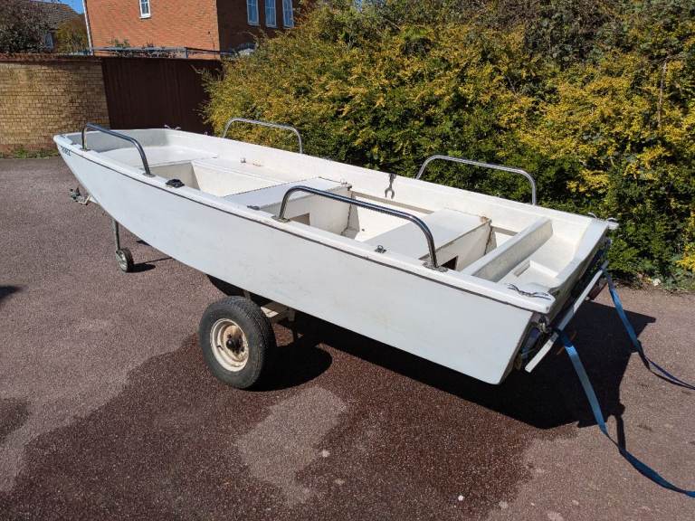 Dory boat with trailer and outboard 