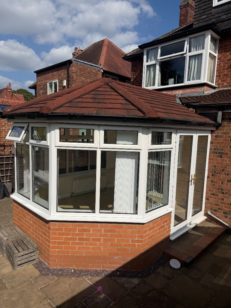 Conservatory with White UPVC Frames and Tiled Roof