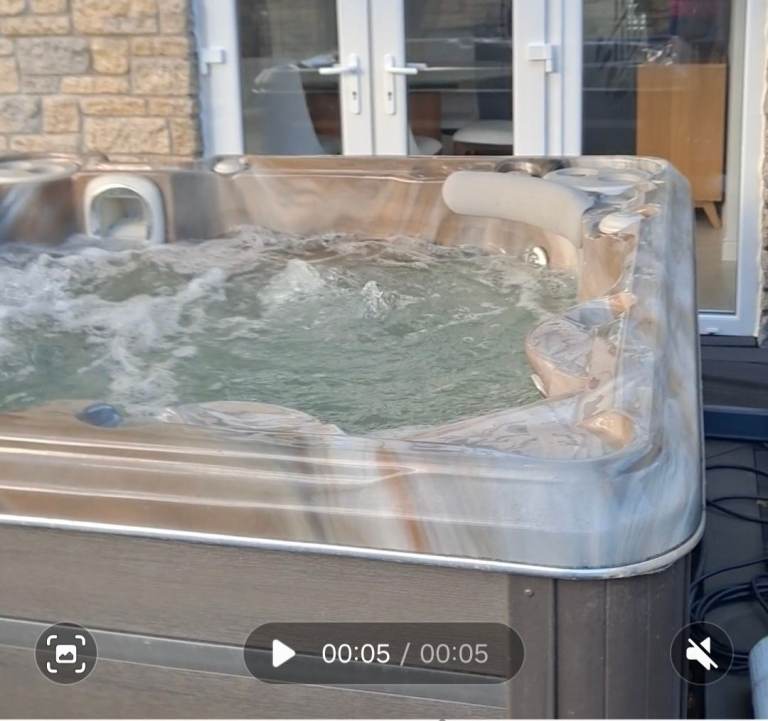 Hydropool hot tub and Covana hydraulic cover