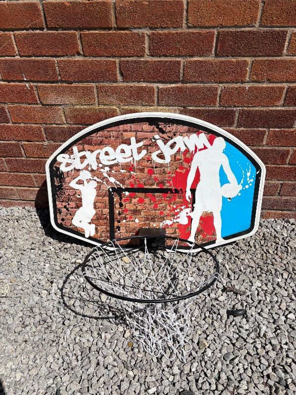 Wall mounted basket ball hoop and board 