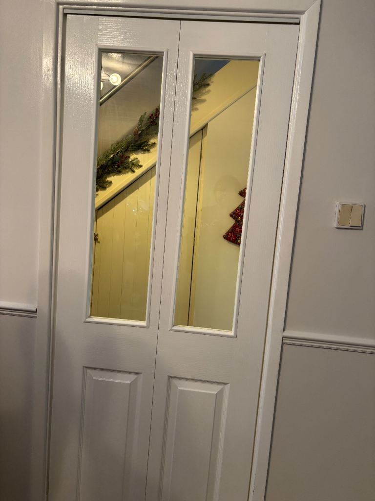 Unused White bi-fold half glazed door. (1 Trim damaged ) 