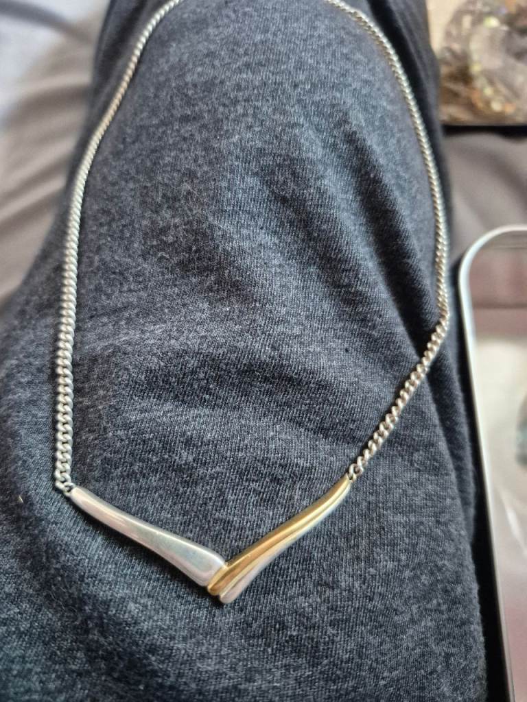 Stunning solid heavy silver neclklace with gold on one side