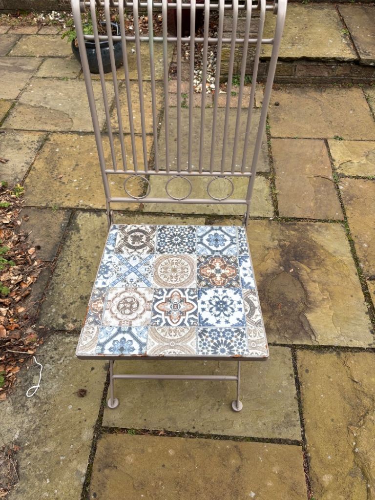 Bistro garden patio set. Four chairs and table. Two chairs not even out of packaging. 