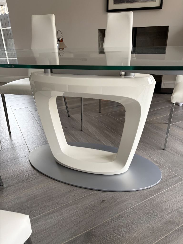 Caligaris Table & 8 white faux leather chairs 