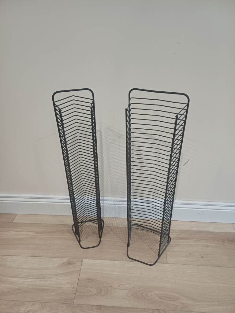 2 black storage racks, one for CDs one for DVDs