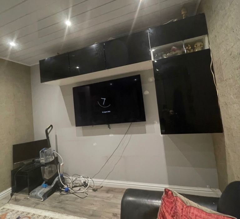 IKEA L-shaped wall storage units in gloss black.
