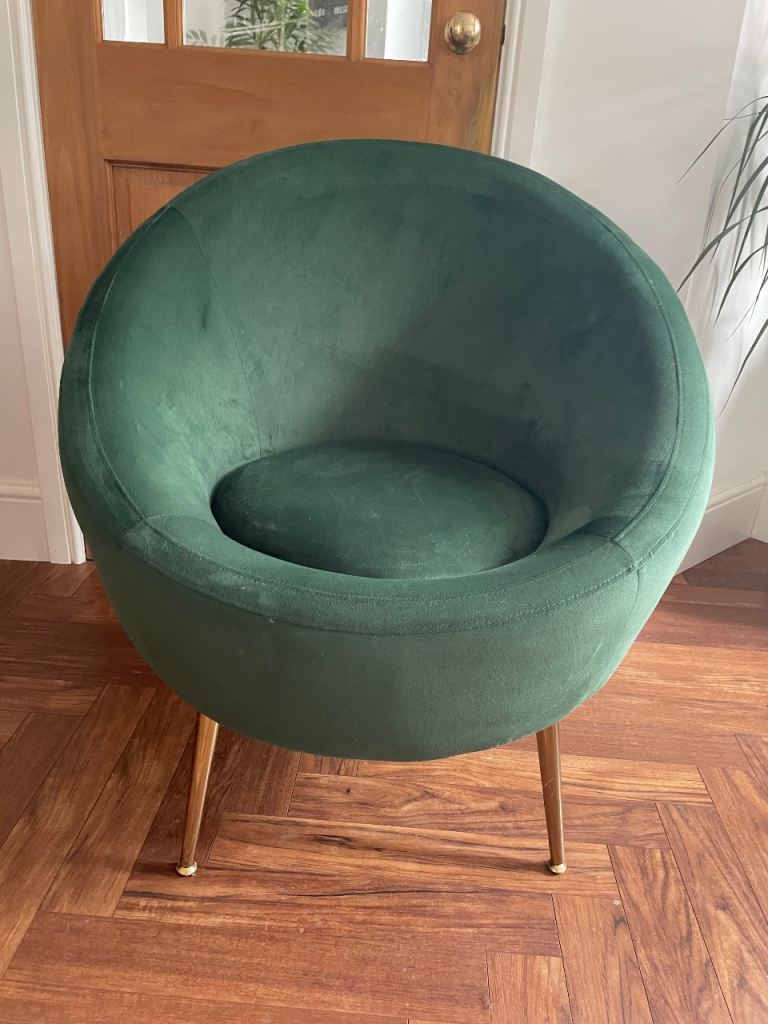 Green velveteen bucket seat with wood coloured legs 