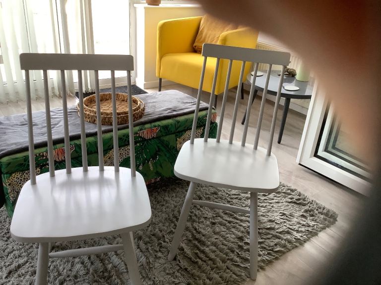 Four grey  wooden dining chairs