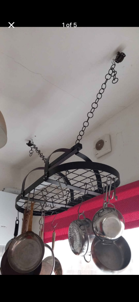 Black oval metal ceiling hanging pan rack