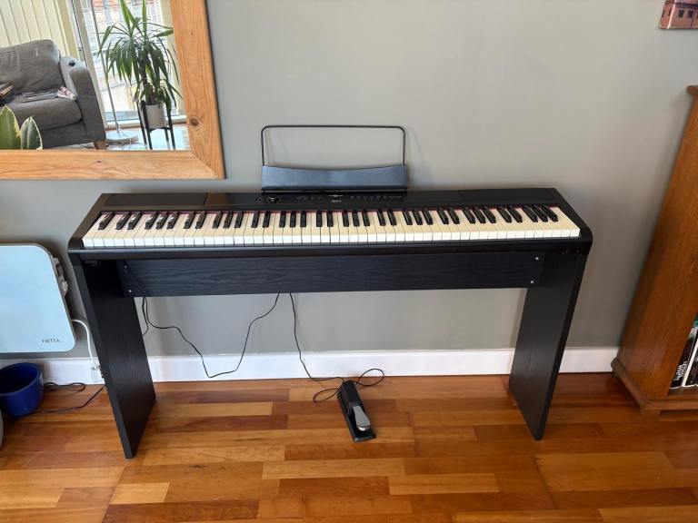 Full size electric piano with universal stand and sustain pedal 
