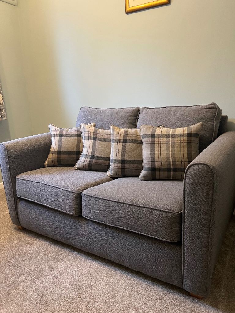 Grey Fabric Sofa Bed with Plaid Cushions – Good Condition