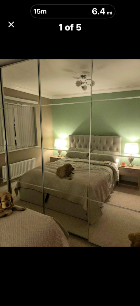 Wardrobe with mirrored sliding doors