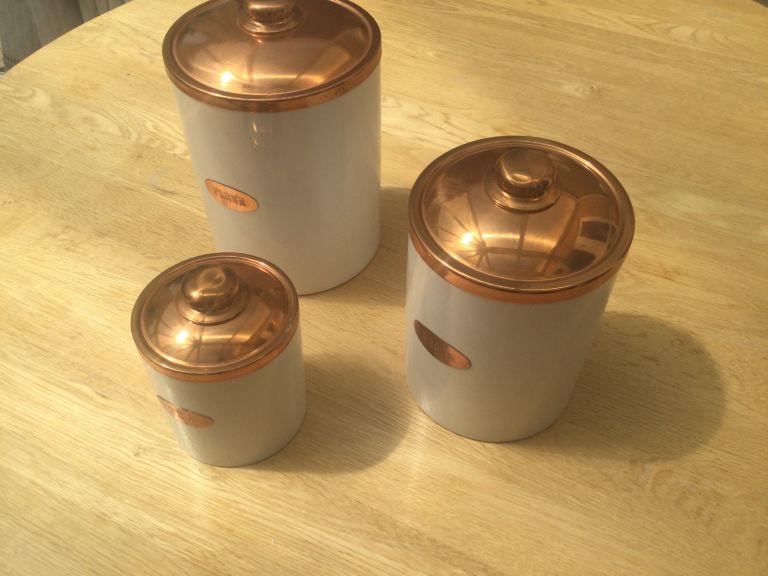 4 very heavy Pottery containers. Flour  Sugar “Coffee” Tea .