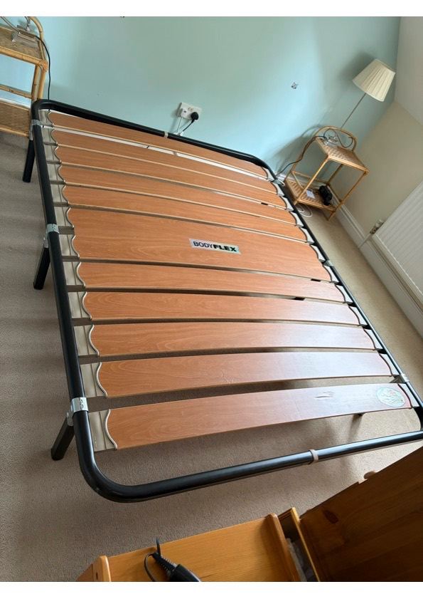 King size metal bed base with wooden slats, no headboard