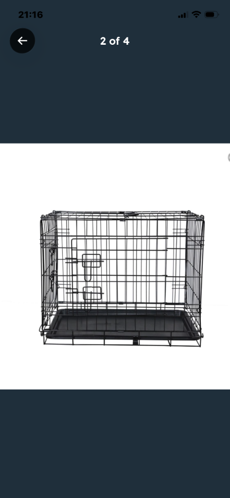 Medium size metal dog crate with plastic inner base.