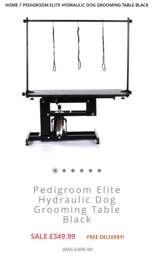 Dog grooming table