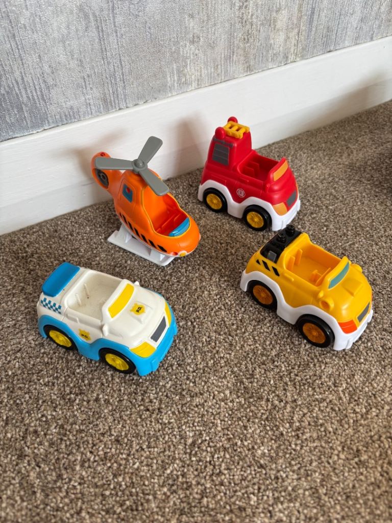 Set of four colourful push-along toy vehicles for little hands