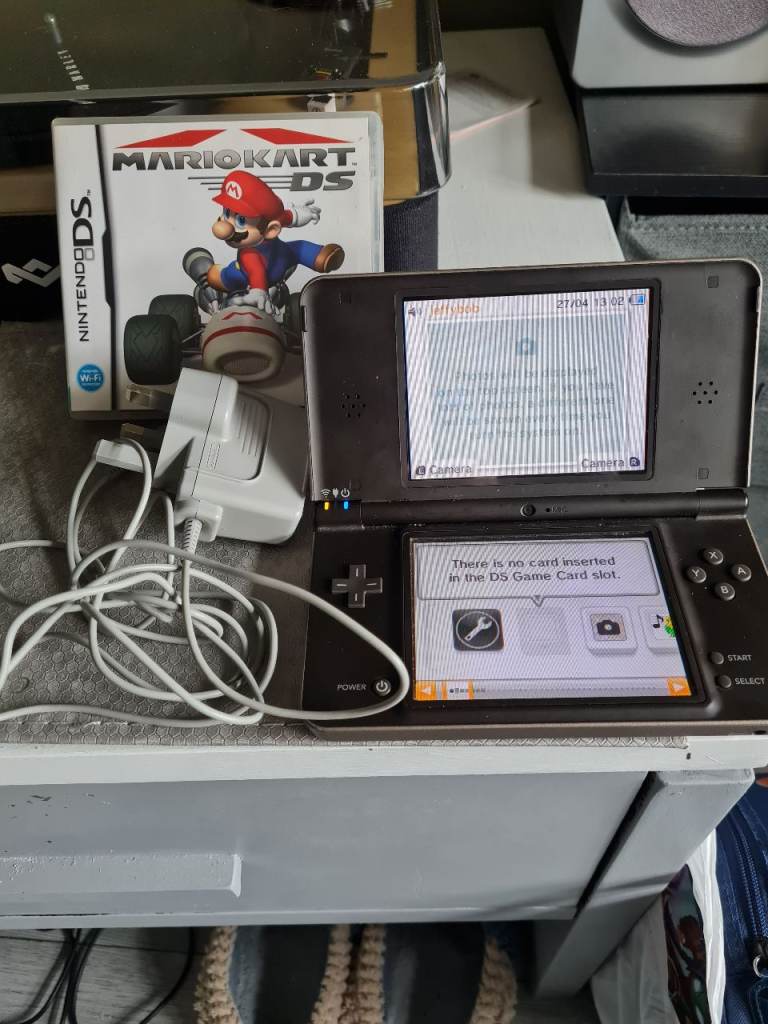Nintendo dsi xl with charger and mario kart game