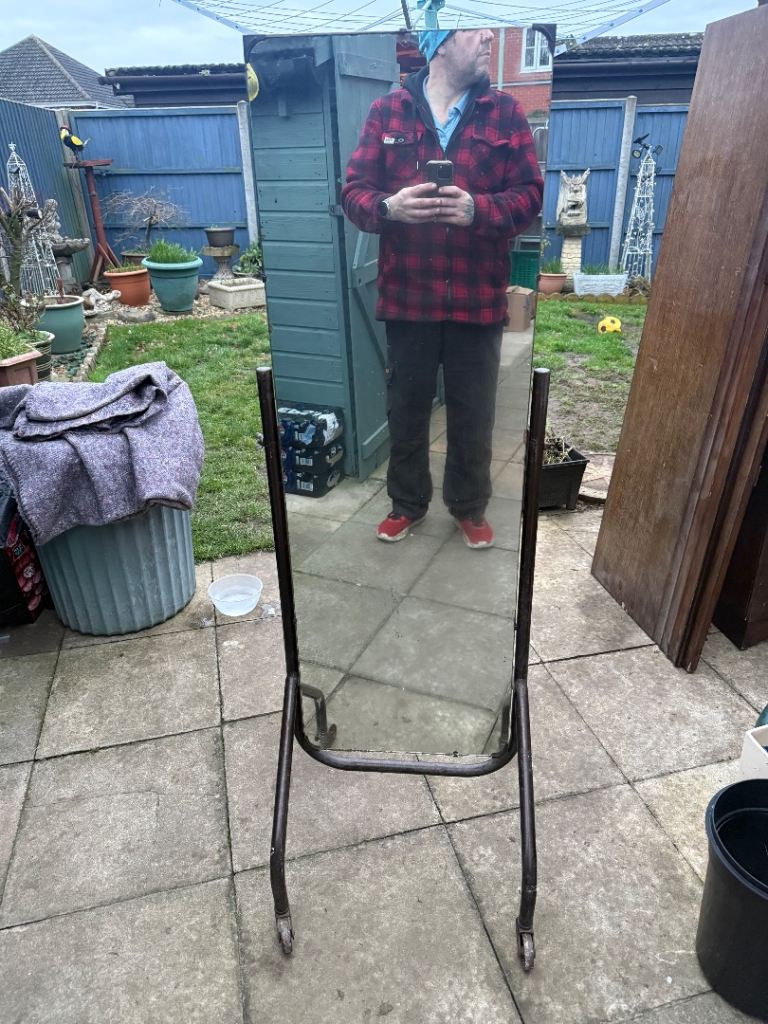 Lovely old mirror on frame with wheels 