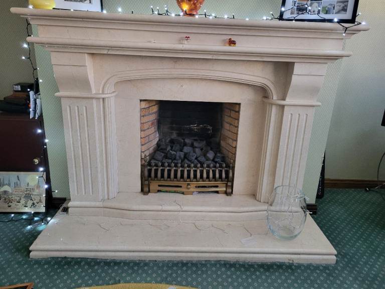 Marble fireplace, hearth and fire