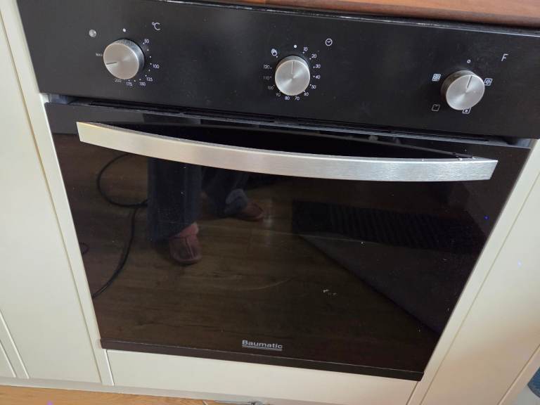 Electric oven, gas hob and cooker hood.