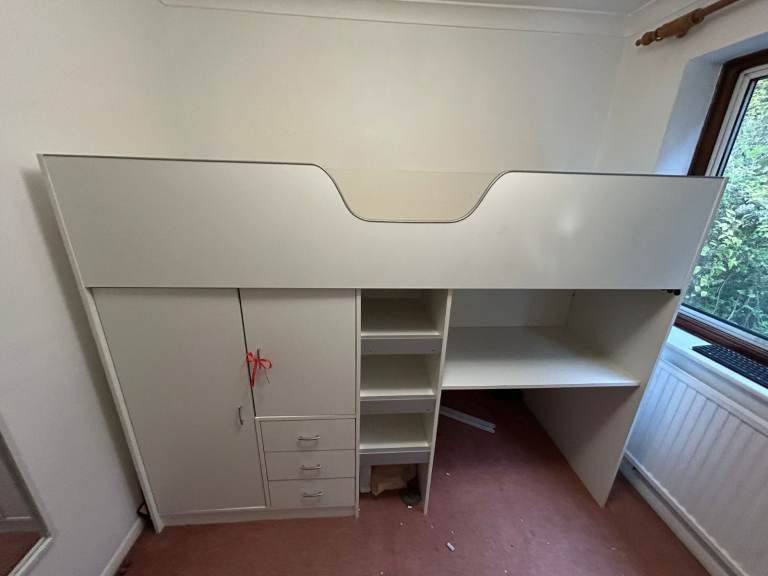 Cabin bed with built-in wardrobe and workstation. 