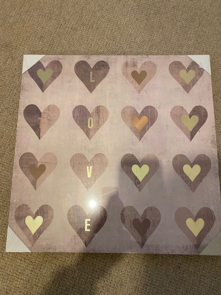 This is an Oliver Gal 'Love Pink Marble' fashion and glam wall art canvas print featuring hearts