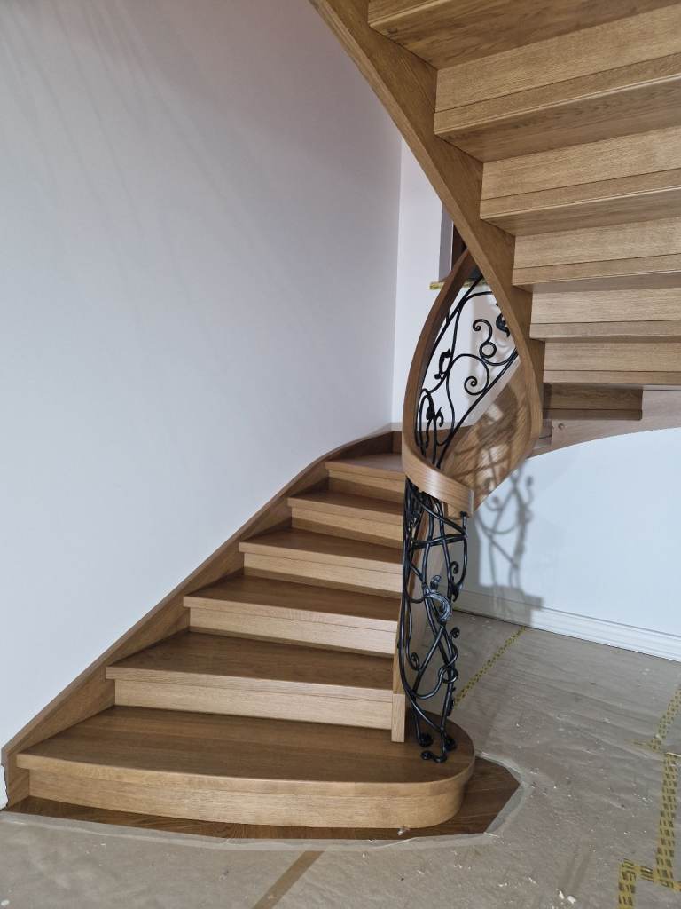 Curved oak staircase with iron balustrade stairs from Poland