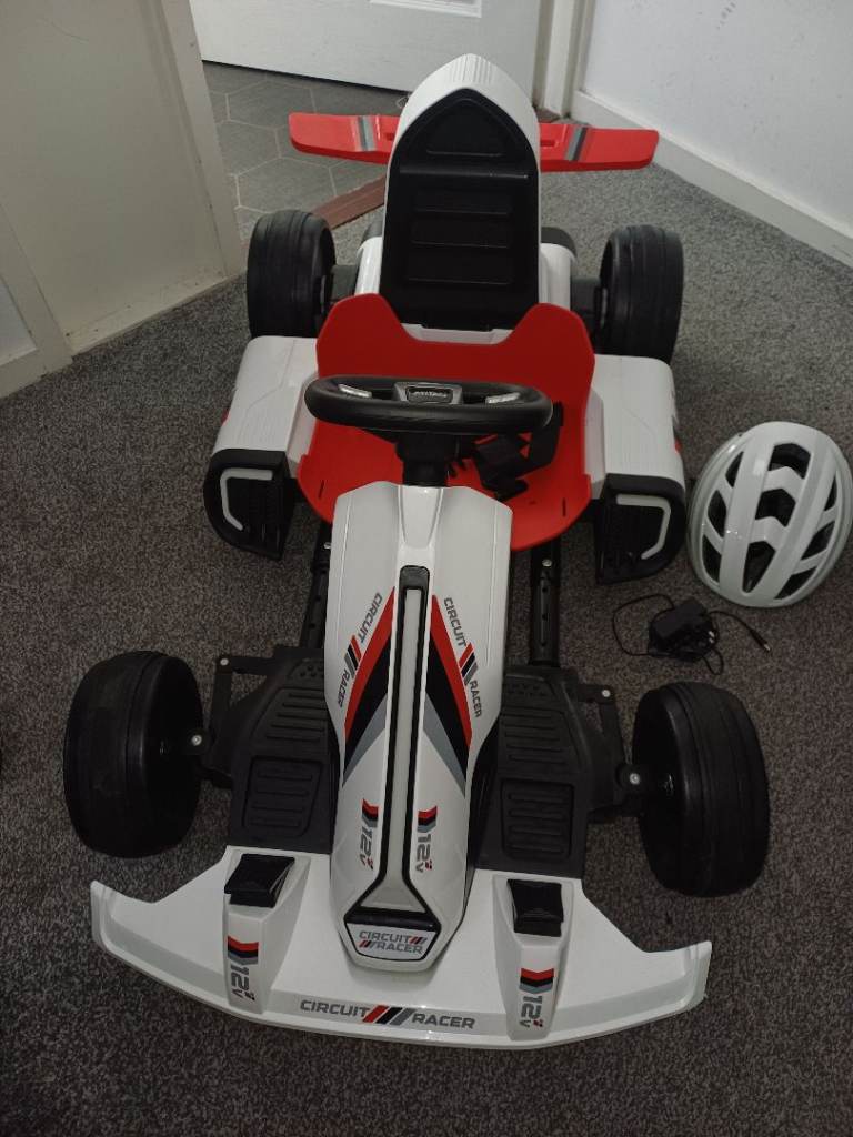 Electric racing car and helmet
