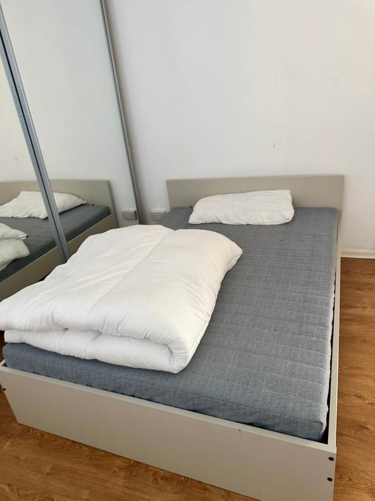 Double Bed with wooden frame and mattress