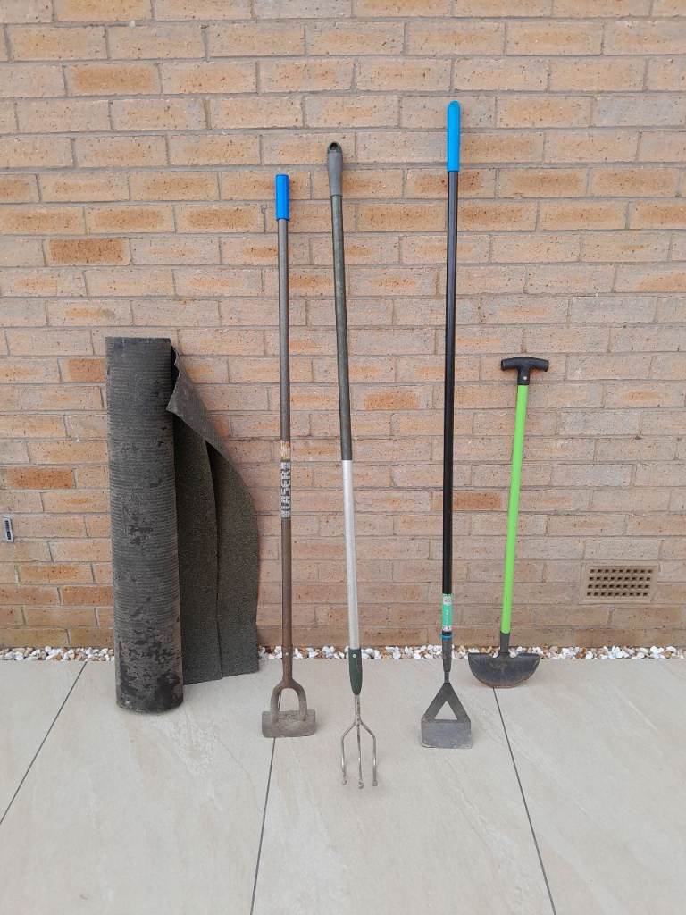Garden tools and shed roof felt.