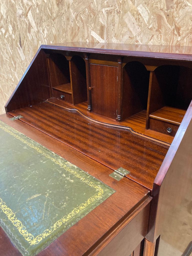 Delivery can be arranged.  Mahogany writing bureau.