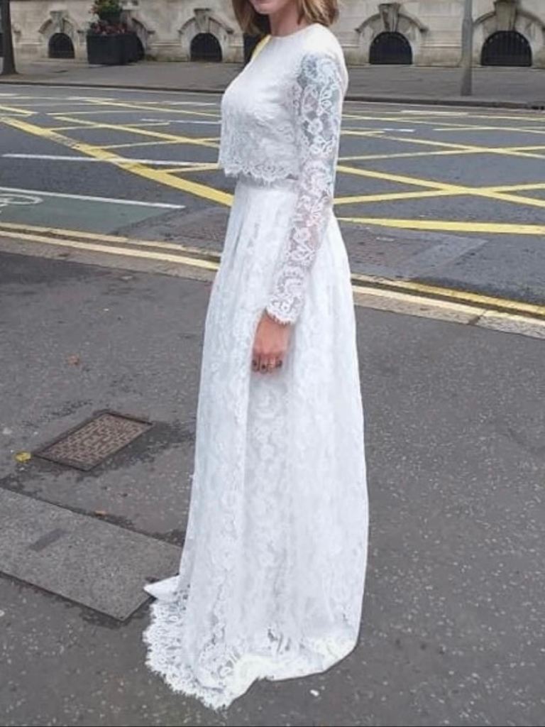 Floor length white lace long sleeve wedding dress