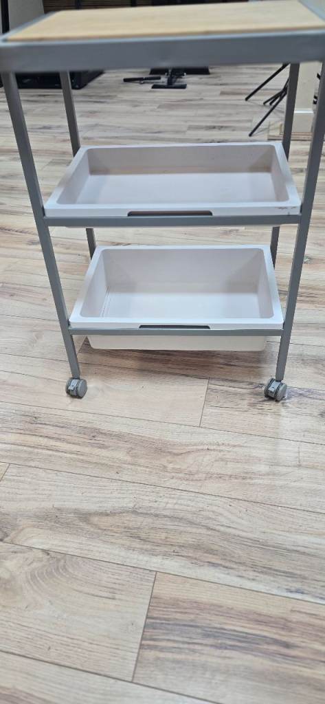 Moveable trolley - wooden top with storage 