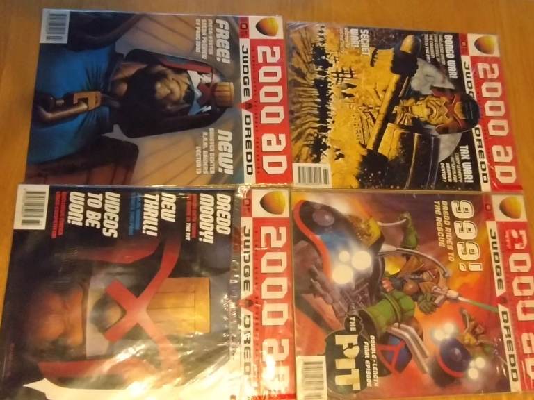 4 classic judge dredd covers from 2000ad. 